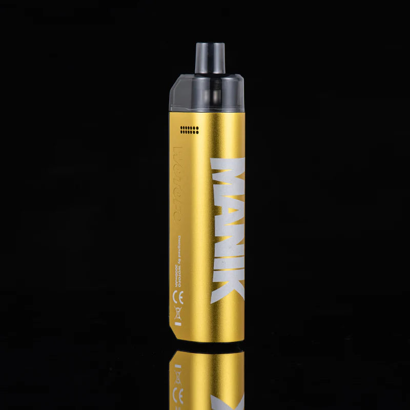 A gold vape device with a black mouthpiece, featuring the brand name 'MANIK' printed vertically in white on the side, set against a solid black background with a subtle reflection below.