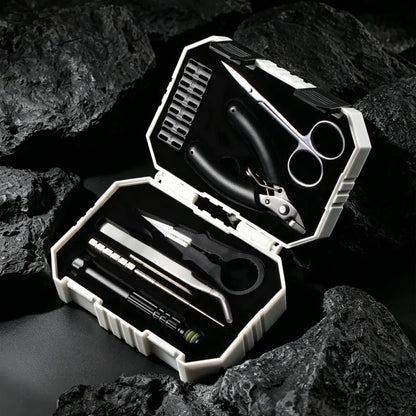 Thundercloud X Coilturd Pro Tool Kit with various tools in an open case on a rocky surface
