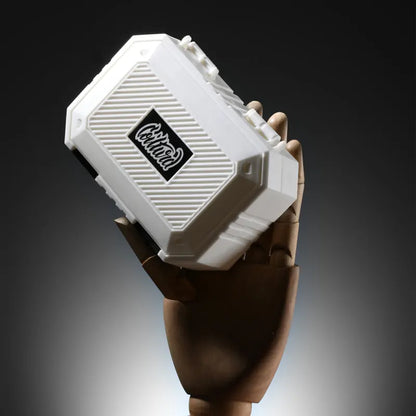 Coilturd tool kit held by a hand against a dark background
