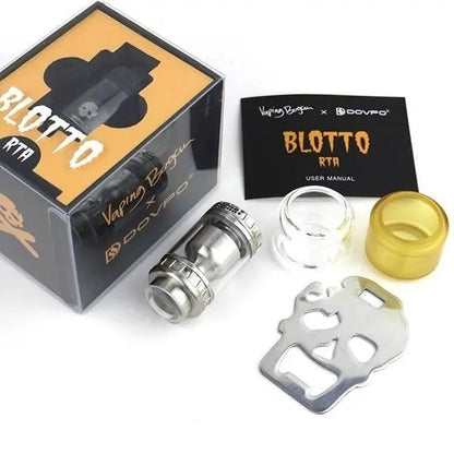 Vaping device components with 'Blotto' branding and a user manual on a white background.