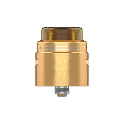 A gold-colored metal vape drip tip with a translucent amber top and a silver threaded base, shown on a plain white background.