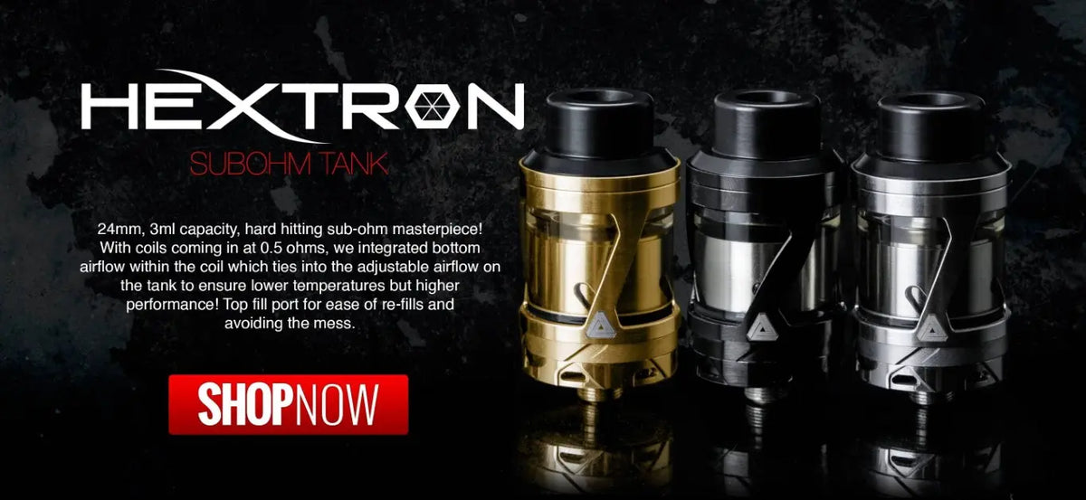 Three HEXTRON Subohm Tank vape devices displayed side-by-side on a reflective black surface against a dark background. The left device is gold and black, while the other two are black and silver.
