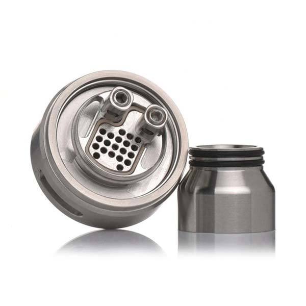 A brushed stainless steel vape coil assembly shown disassembled, with the top section on the left and the bottom chamber on the right, on a clean white background with a soft reflection.