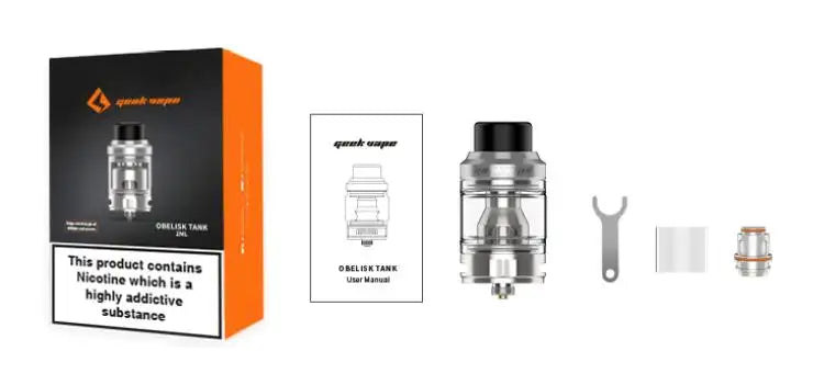 A GeekVape Obelisk Vape Tank replacement atomizer kit displayed on a white background, including the retail box, user manual, the main clear and black tank, a metal tool, and a replacement coil.